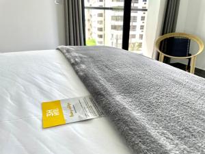 Säng eller sängar i ett rum på 3H Hotel Rodadero SANTA MARTA