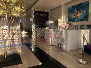 a store with a counter with a tree on it at Relax Hôtel Oujda in Oujda