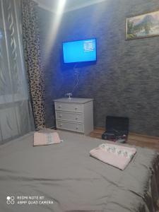 Ein Bett oder Betten in einem Zimmer der Unterkunft Guest House Ivanna
