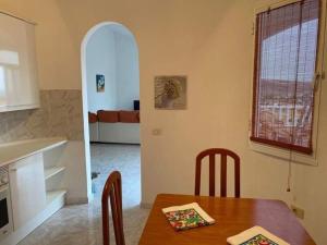 a kitchen and dining room with a table and a dining room at Sol y Mar in Tarajalejo
