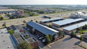 an overhead view of a town with buildings and a parking lot at Americas Best Value Inn-Livonia/Detroit in Livonia