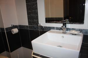a bathroom with a white sink and a mirror at Saint Sofia Guest House Къща за Гости in Nesebar +42 photos