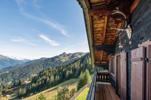 a balcony of a house with a view of mountains at Golmerhaus in Tschagguns