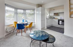 a kitchen and dining room with a table and chairs at Coppergate Mews Apartment 4 in Doncaster
