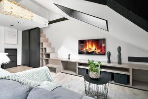 a living room with a couch and a fireplace at In the heart of Narvik ! in Narvik