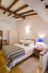 Postel nebo postele na pokoji v ubytování La Casona Hotel Boutique