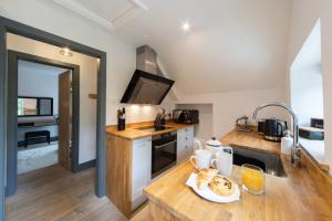 a kitchen with a plate of food on a counter at The Hideaway in Great Massingham