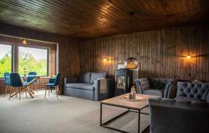 a living room with a couch and chairs and a table at Atlantic View Ingerstua in Frei