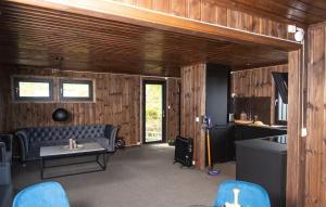 a living room with a couch and a table at Atlantic View Ingerstua in Frei