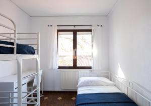 Postel nebo postele na pokoji v ubytování La casa de la Playa. Piscina, Wifi y Terraza.