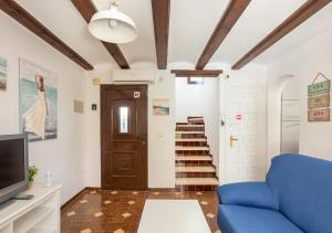 TV a/nebo společenská místnost v ubytování La casa de la Playa. Piscina, Wifi y Terraza.