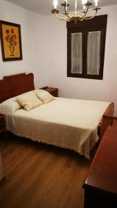 Säng eller sängar i ett rum på Casa Fuente la Calle
