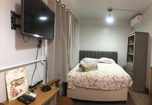 TV a/nebo společenská místnost v ubytování Studio Container Bombinhas