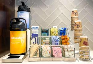 a table with a thermos and a bunch of food at Best Western Plus Ft Lauderdale Hollywood Airport Hotel in Hollywood +20 photos