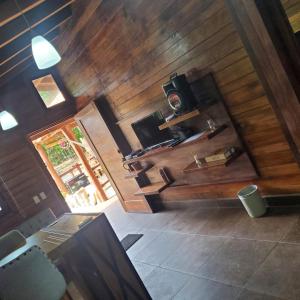 an overhead view of a living room with wooden walls at Cabañas Corazón in Troncones +75 photos