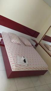 a small bed in a room with at Hotel Progresso in Curitiba