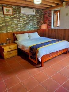 Postel nebo postele na pokoji v ubytování Jinsha Old Street B&B + 21 fotografií