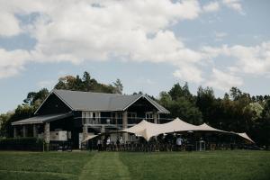 a large black building with a tent in front of it at HUs - Boutique Venue & Accommodation in Riverhead