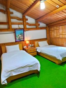Postel nebo postele na pokoji v ubytování Jinsha Old Street B&B