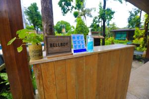 a wooden counter with a sign that says believe at AKIRA Lipe Resort in Ko Lipe