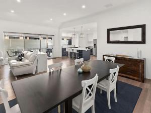 a kitchen and living room with a table and chairs at Vasse Manor in Vasse