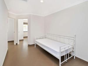 a white bunk bed in a white room at Ocean Walk Abbey in Vasse