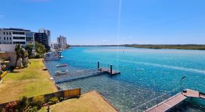 a large body of water with boats in it at Sea-Hi Beachside Apartment in Maroochydore