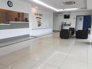 a waiting room with a sun kiss sign on the wall at Sun Inns Hotel Kota Laksamana Melaka in Melaka