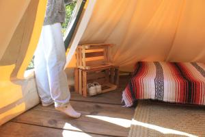 a person standing in a room in a tent at Tipis Cuetzalan in Cuetzalán del Progreso +16 photos