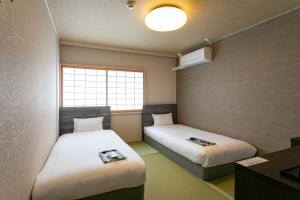 Ένα ή περισσότερα κρεβάτια σε δωμάτιο στο Bakery Hotel Chateau D'or