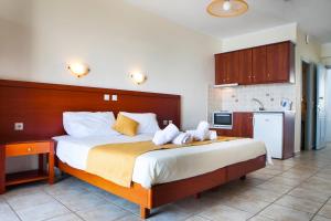 Kuchyň nebo kuchyňský kout v ubytování Olive Bay Hotel