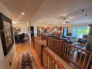a large living room with a kitchen and a living room at Among the Aspens Family Cottage in Bozeman