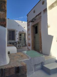 a view from the outside of a house with a patio at Latmos 1860 in Skala +37 photos