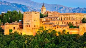 a large castle sitting on top of a mountain at Recogidas Apartment 23 in Granada
