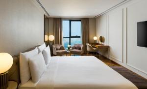 a hotel room with a bed and a television at Millennium Place Barsha Heights Hotel Apartments in Dubai