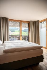 Ένα ή περισσότερα κρεβάτια σε δωμάτιο στο Mountain Lodge Margit