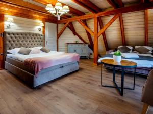 Postel nebo postele na pokoji v ubytování Helenówka AGRO & SPA
