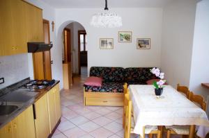 a living room with a couch and a table at Appartamenti -Casa Nicolussi- in Molveno