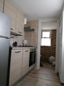 Kuchyň nebo kuchyňský kout v ubytování B&B Curtopassi