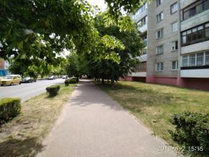 a walking path in front of a building at Apartament on Sovetskaya 135 in Bobruisk