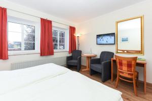 Postel nebo postele na pokoji v ubytování Hotel Garni Benser Watt