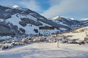 a ski resort with a sign on a mountain at Chalet Wallehen in Saalbach Hinterglemm