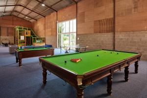 a large room with a pool table and a playground at Pheasant Walk at Eaton Manor in Church Stretton