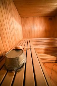 a sauna with a pot sitting in the inside of it at LVM tūrisma un atpūtas centrs "Spāre" in Spāre
