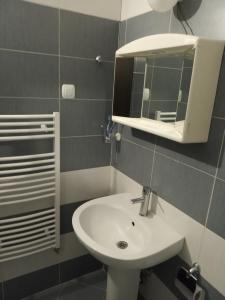 a bathroom with a sink and a mirror at IGLIKA 2 SNOWY NIGHT V 31 in Borovets +68 photos