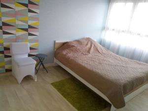 Postel nebo postele na pokoji v ubytování Appartement lumineux proche de Rouen et Paris