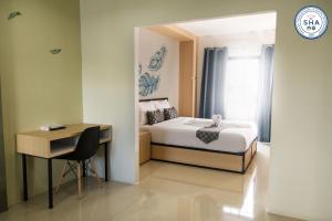 Letto o letti in una camera di Sirimunta Hotel Chiang Rai Suite & Residence