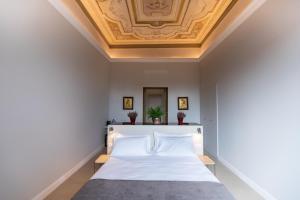 Posteľ alebo postele v izbe v ubytovaní Domus 21 Luxury Suites