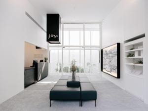 a living room with a couch and a table at Lloyd's Inn in Singapore
