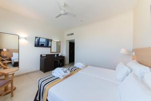 Кровать или кровати в номере The Preluna Hotel